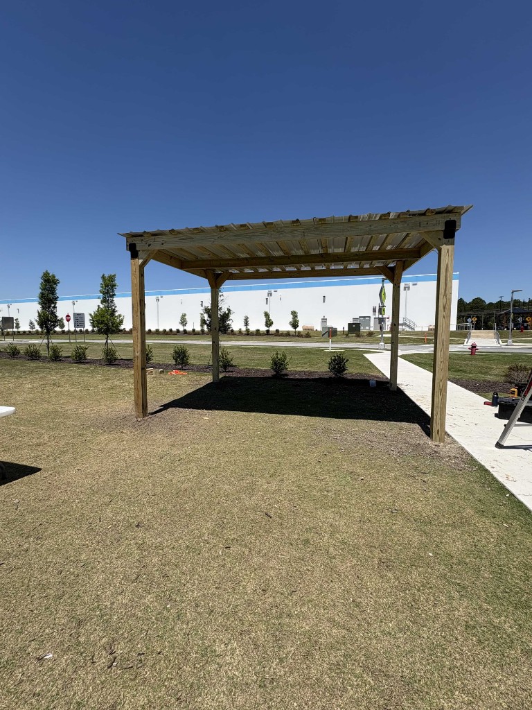 Completed commercial pergola outside a facility